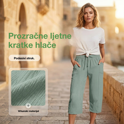 💖【Kupite jedan, dobijte jedan gratis】👖👖Ženske jednobojne plisirane capri hlače od pamuka i lana - hladne i prozračne, laskaju obliku nogu, elegantne i ležerne